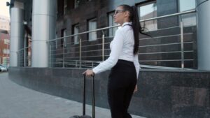 A Business Traveler with A Suitcase, Showcasing Morning Routines for Business Travelers
