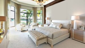 Bright modern bedroom with large windows, neutral tones, and creative bedroom accessories