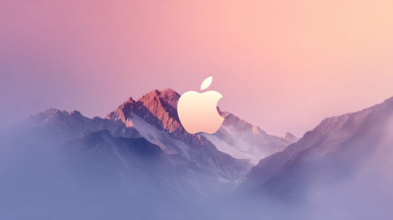 Logotipo de Apple centrado frente a un paisaje montañoso con tonos rosados y morados