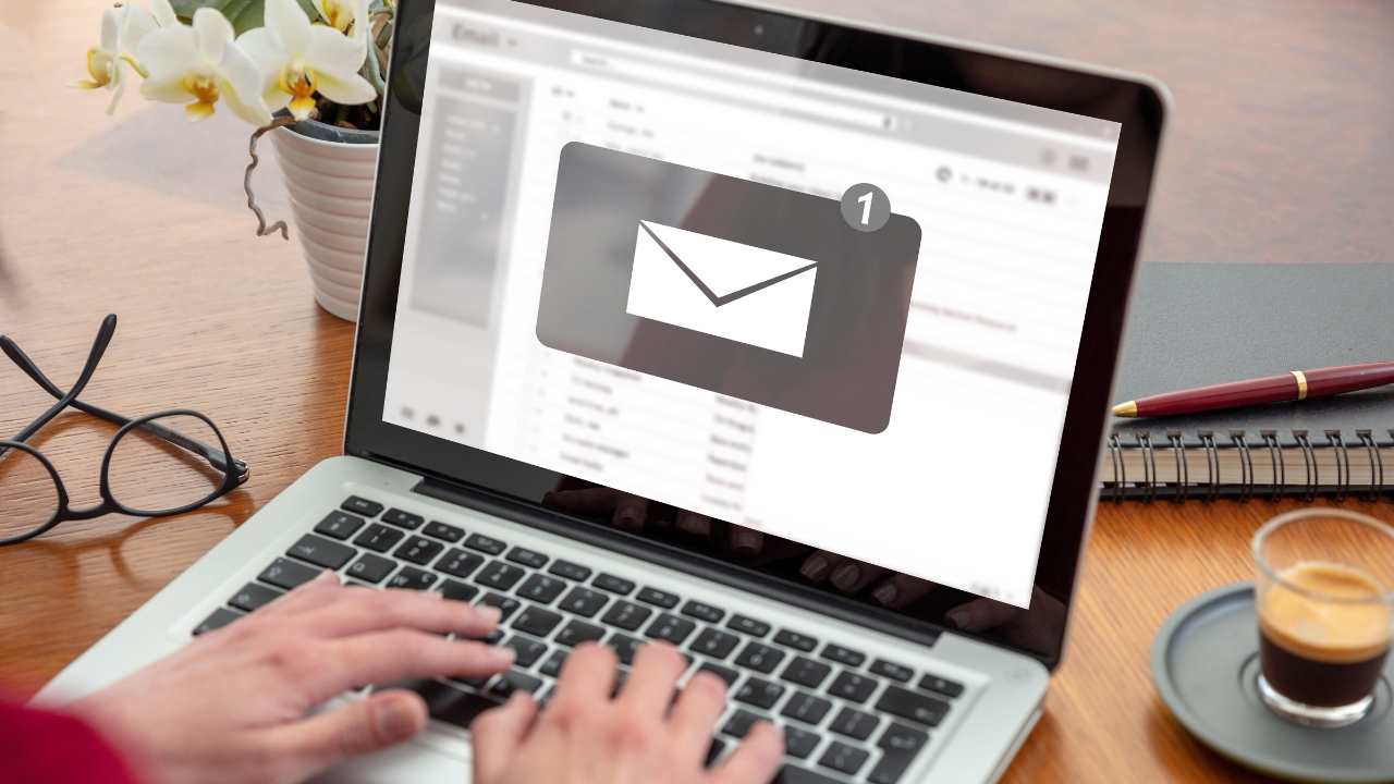 Person checking an email notification on a laptop