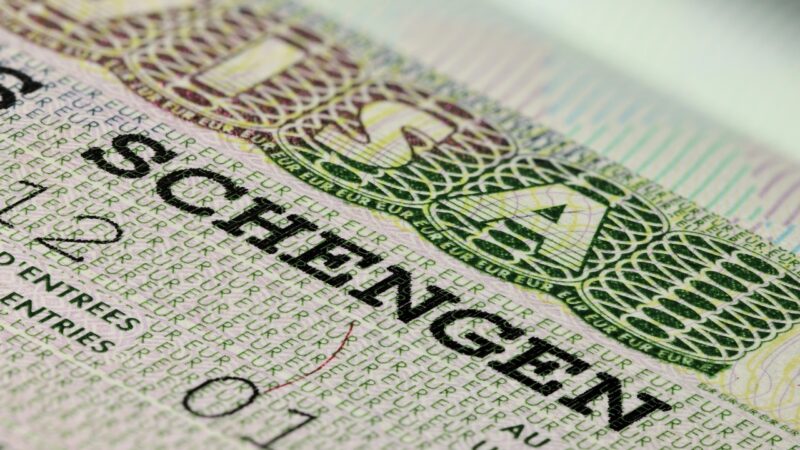 Close-up of a Schengen visa stamp in a passport
